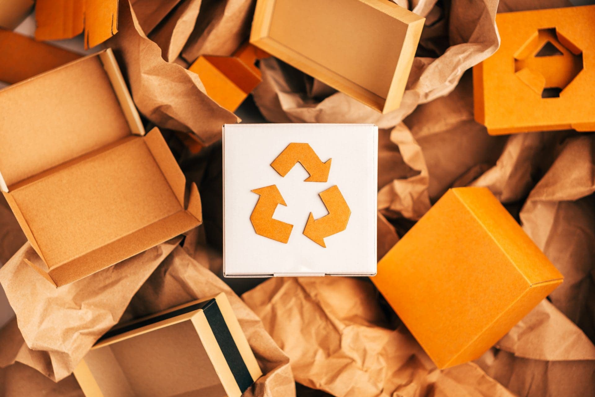 Cardboard boxes and packaging with recycling symbol
