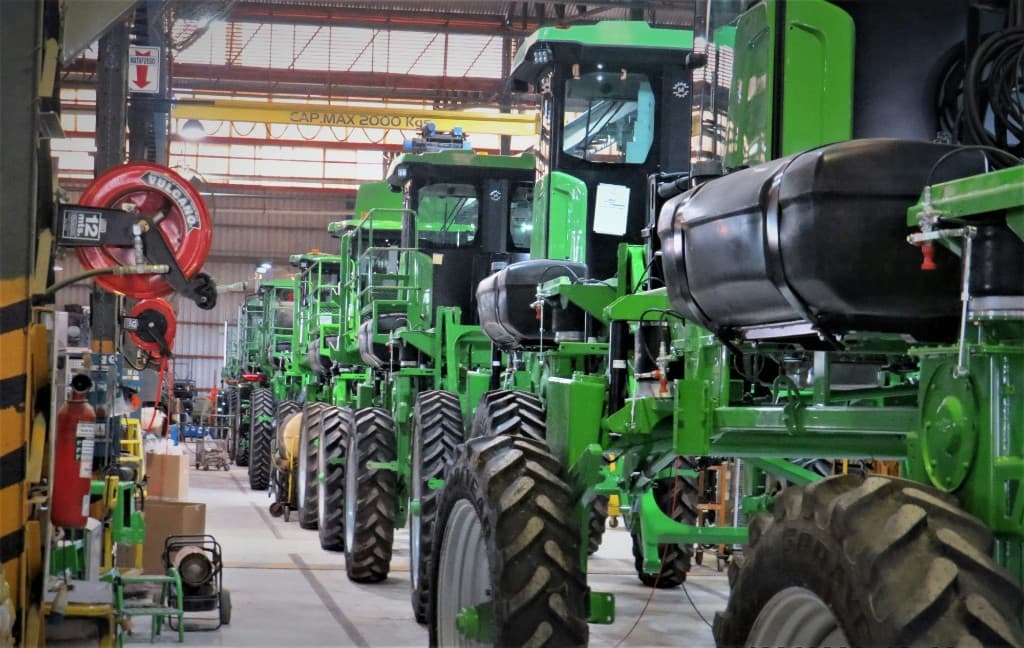 Agricultural equipment manufacturing facility with tractors